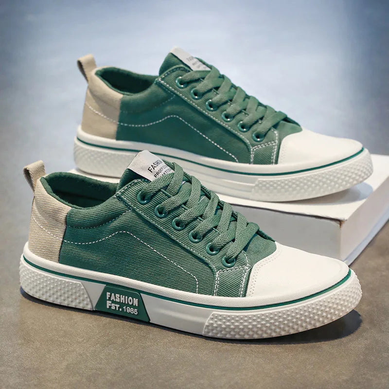 Pair of women's blue canvas trainers with beige accents and flexible rubber sole