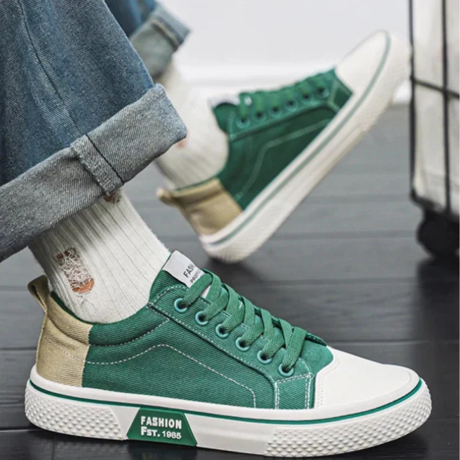 Overhead view of women's canvas trainers highlighting lace-up closure and toe cap detail