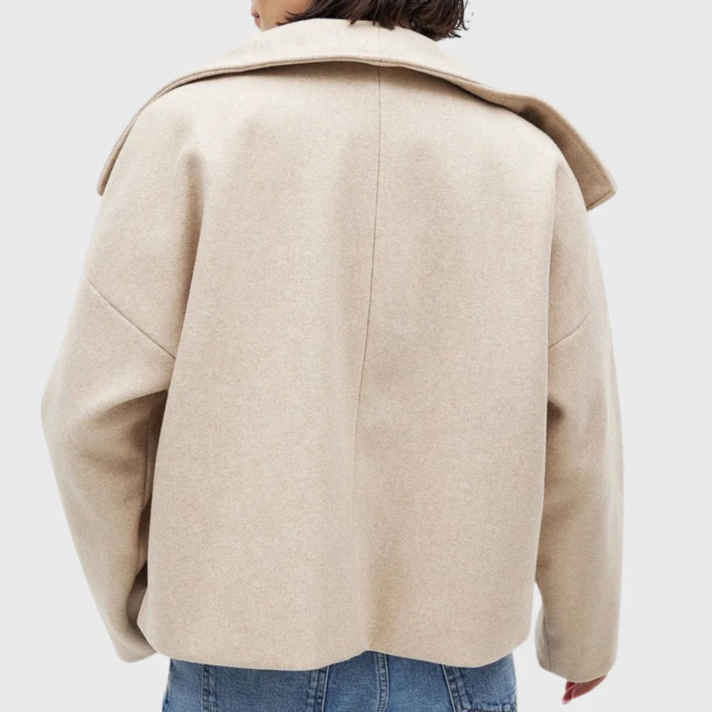 Full-length view of women's cropped coat with wide lapels and relaxed fit