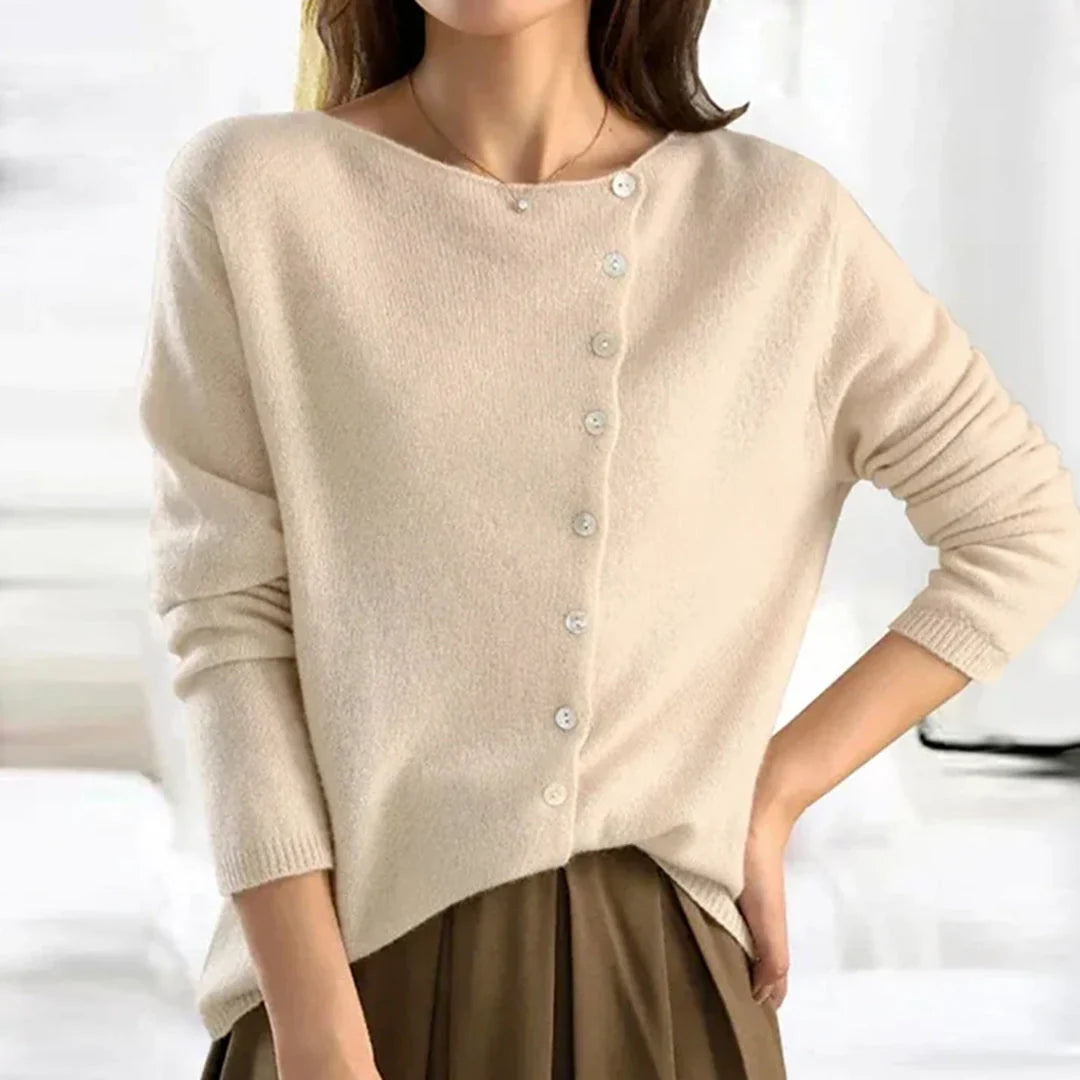 Side view of relaxed fit women's cardigan showing hip-length hem and fine knit drape