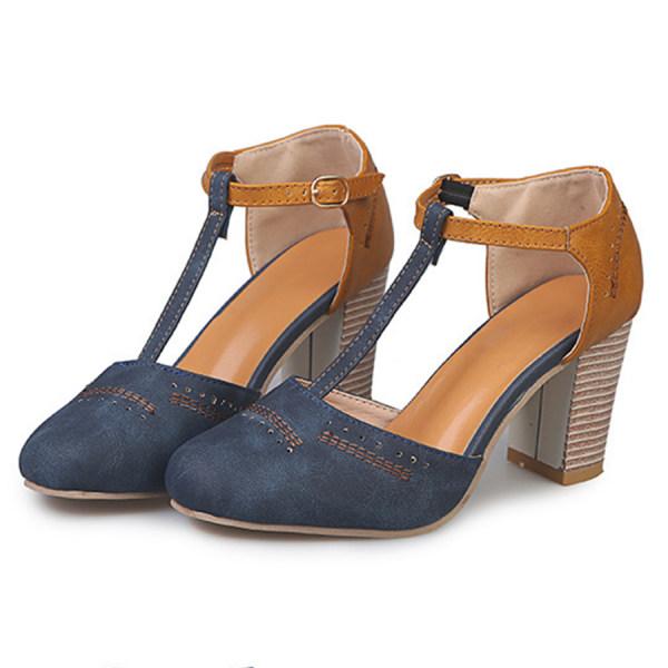 Side view of women's two-tone block heel shoes with adjustable ankle strap and buckle closure