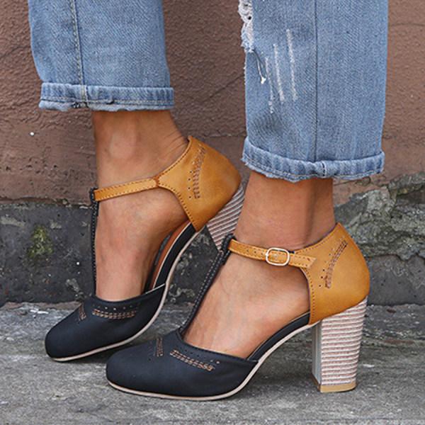 Women's navy and tan T-bar heels featuring round toe and structured fabric with smooth finish