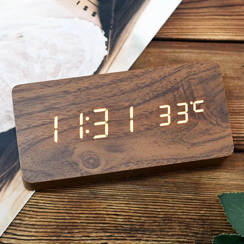 LED wooden alarm clock displaying time and temperature on bedside table with natural wood grain finish