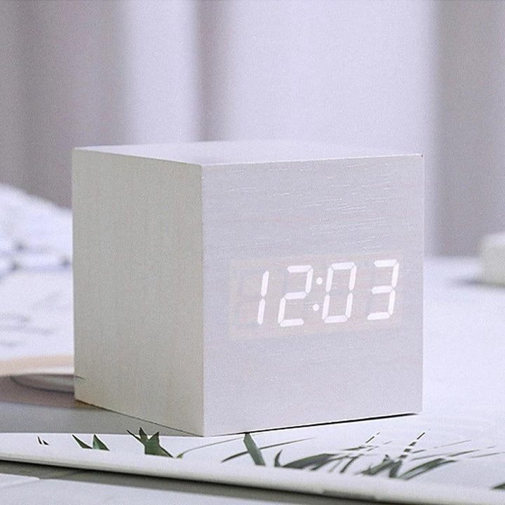Compact LED wooden clock displaying time date and temperature readings
