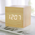 Compact wooden alarm clock with LED screen showing time and temperature for bedroom