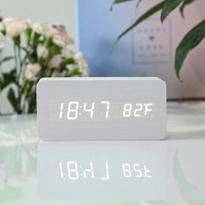 USB powered wooden alarm clock with LED screen on office desk