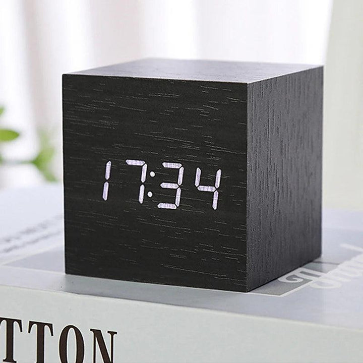 Bedside wooden alarm clock with LED display and voice activation mode