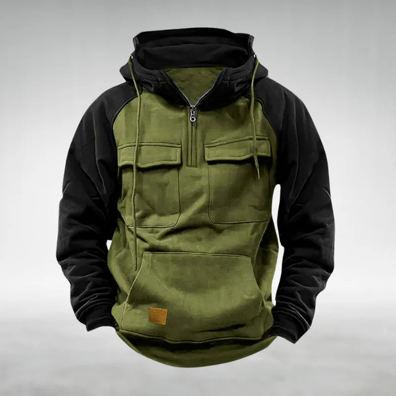Close-up of quarter-zip neckline and chest flap pockets on men's two-tone hoodie
