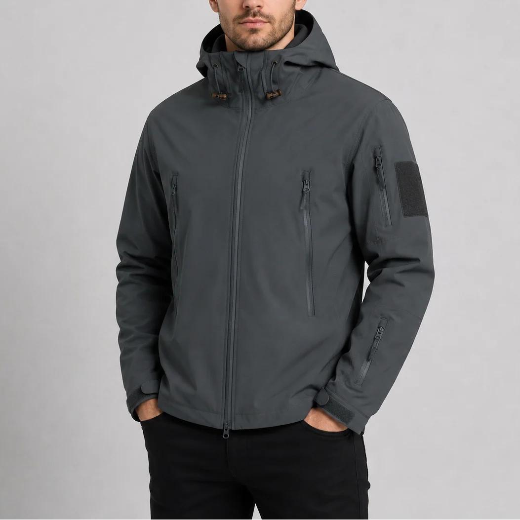 Men's hooded softshell jacket in grey with multiple zip pockets and adjustable hood for outdoor wear