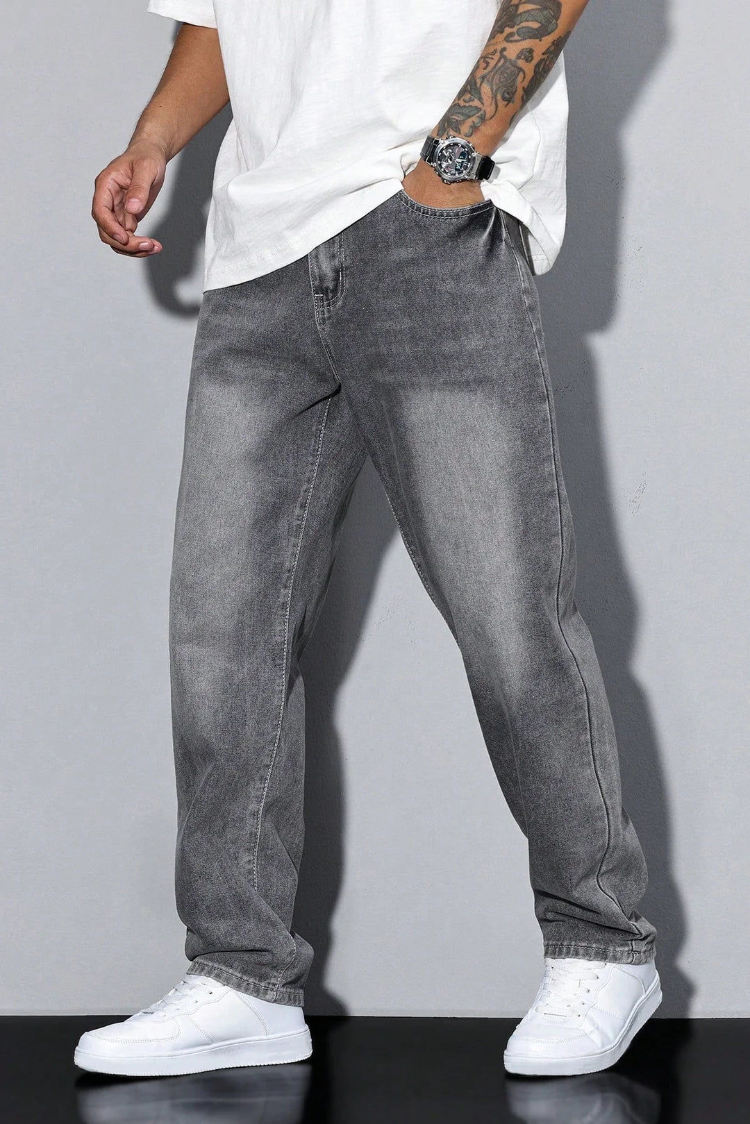 Detail of men's jeans pocket construction and washed grey denim fabric texture