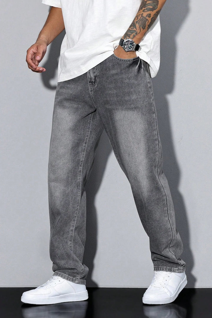 Detail of men's jeans pocket construction and washed grey denim fabric texture