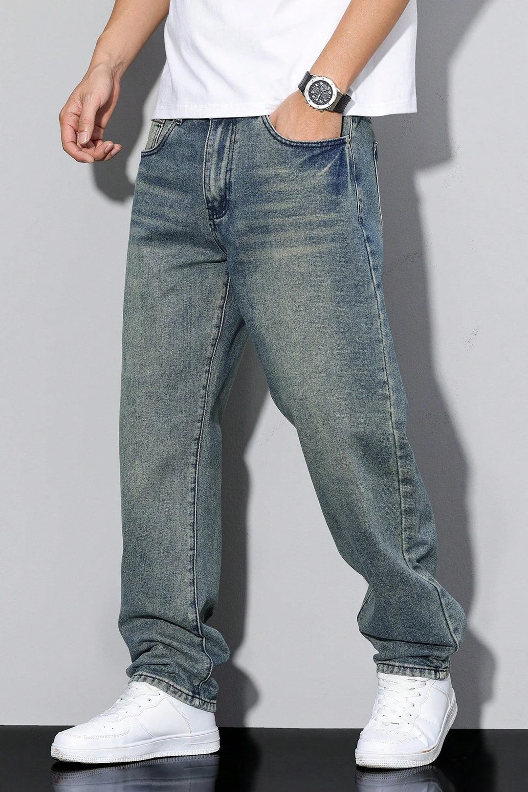 Back view of men's loose fit straight leg jeans showing rear pockets and seam detail