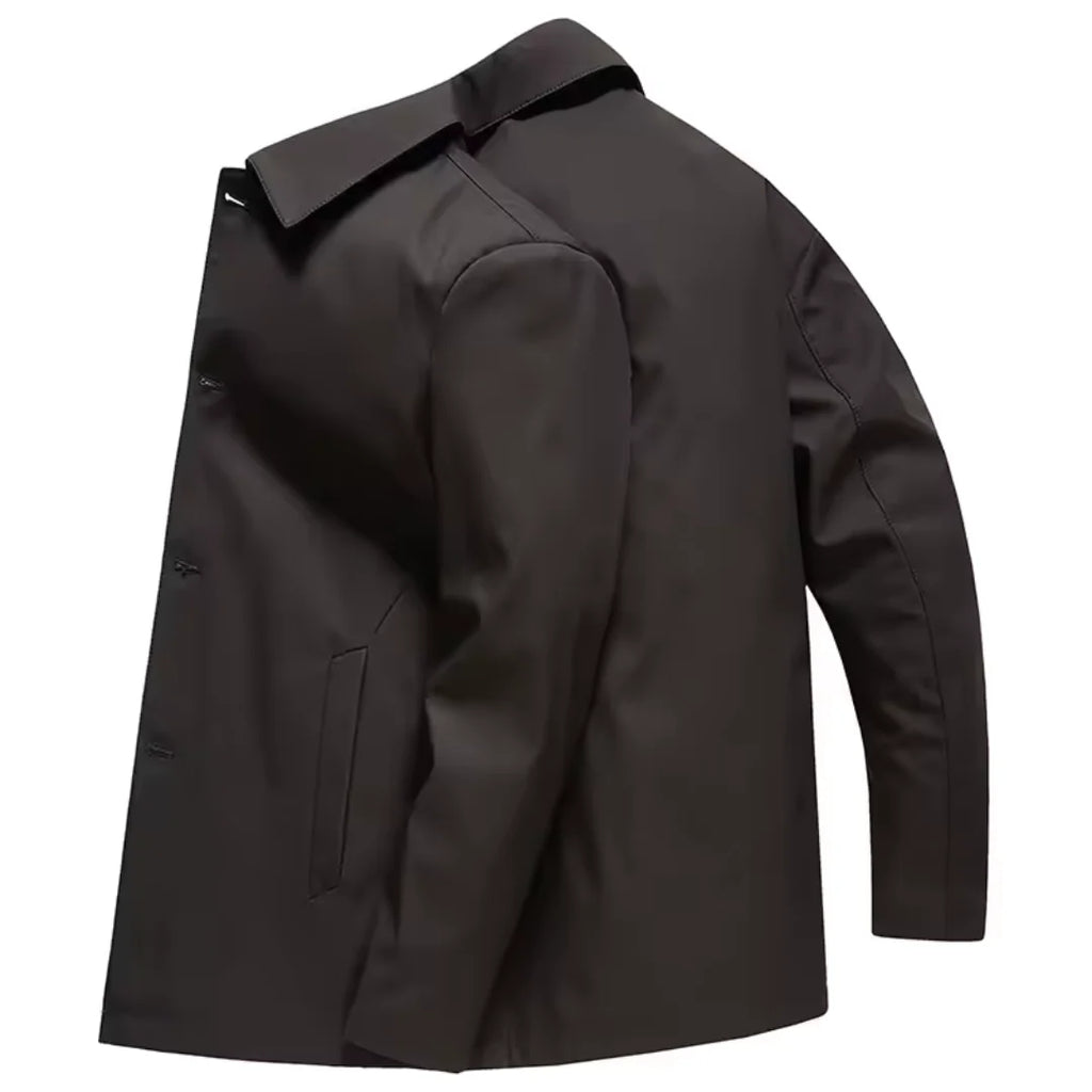 Close-up view of men's tailored coat showing structured fabric and button detailing