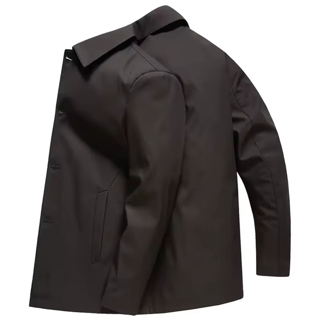 Close-up view of men's tailored coat showing structured fabric and button detailing