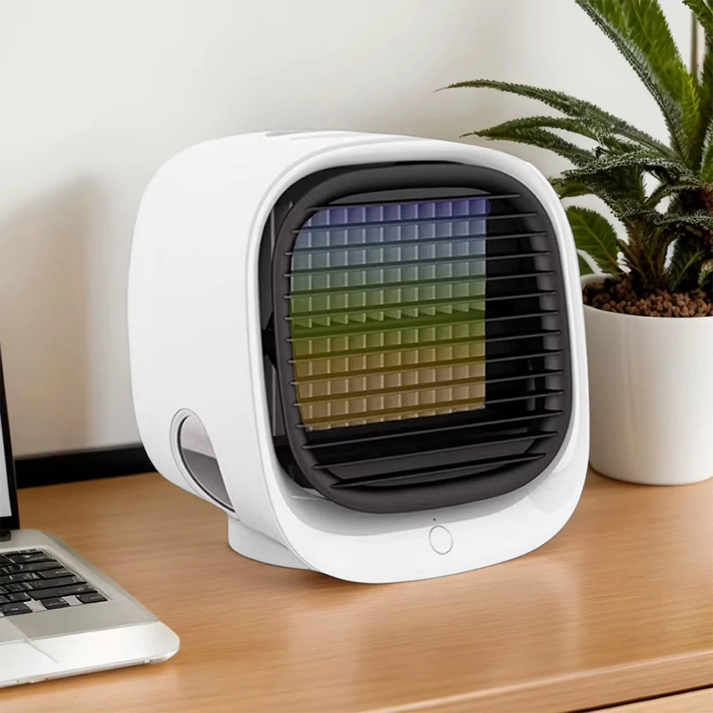 Small evaporative air conditioner with water reservoir slots and quiet fan mechanism for personal cooling zones