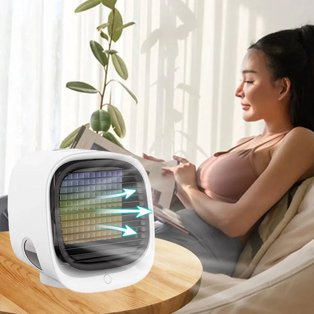 Compact air cooling device featuring modern white finish and dark ventilation panel for localised temperature relief
