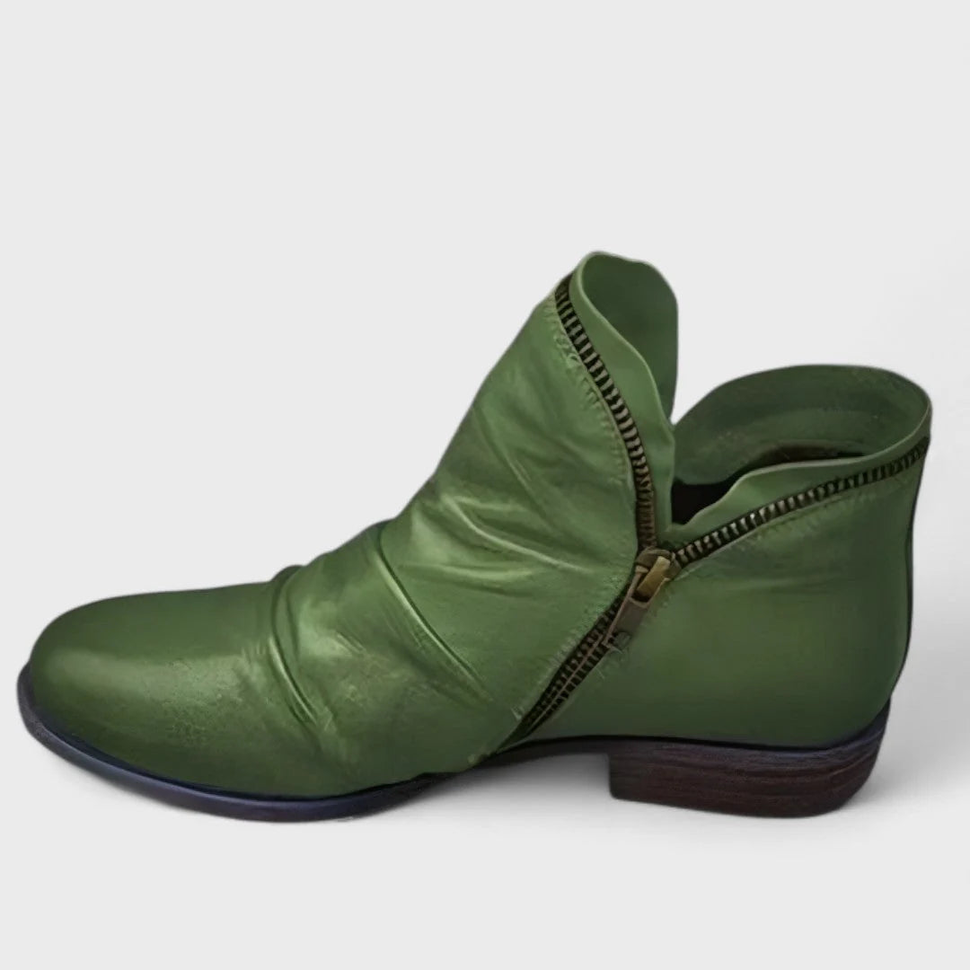 Detail view of ruched vamp and stitching on women's ankle boots