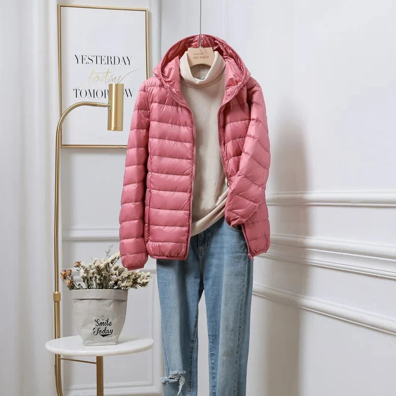 Cropped hooded puffer jacket front view showing quilted design and zip closure