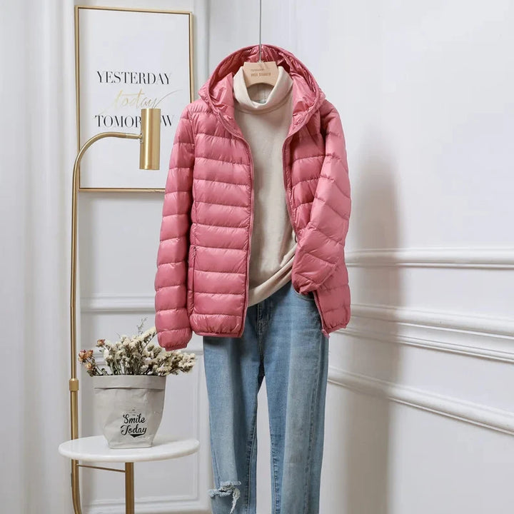 Cropped hooded puffer jacket front view showing quilted design and zip closure