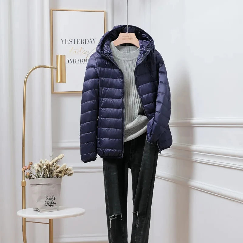 Cropped puffer jacket styled with knitwear demonstrating layering versatility for casual wear
