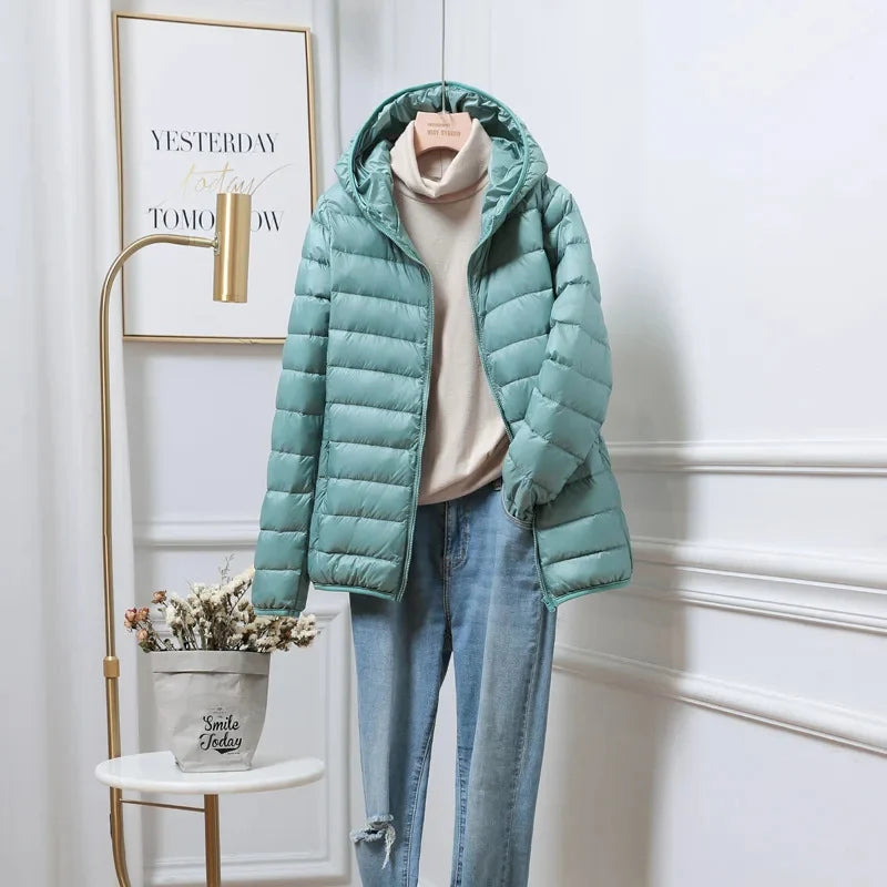 Women's quilted puffer jacket back view showing horizontal channel stitching detail