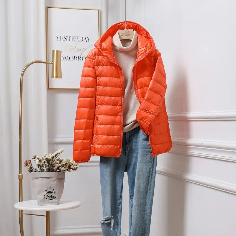 Cropped puffer jacket worn over jumper showing practical hip length fit