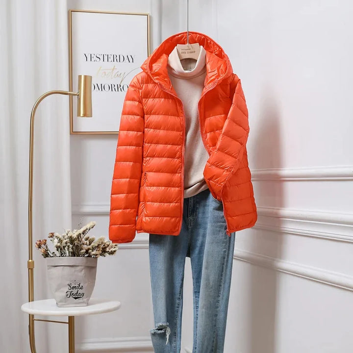 Cropped puffer jacket worn over jumper showing practical hip length fit
