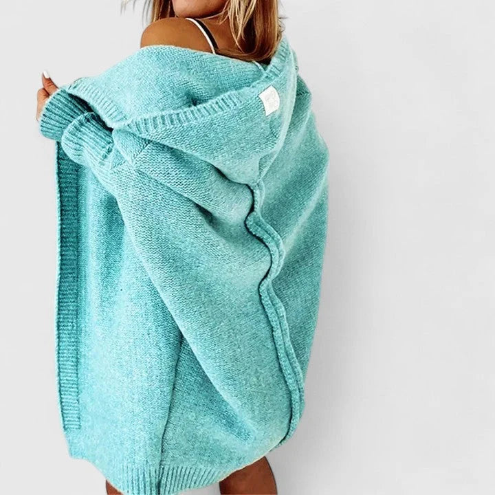Close-up of oversized hooded cardigan showing knit texture and open-front design