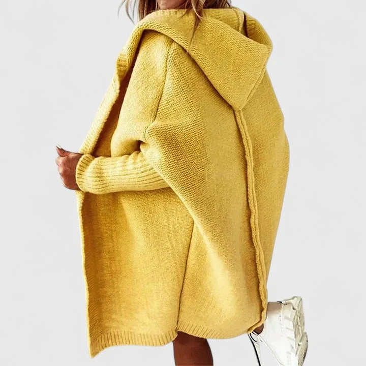 Side view of women's hooded cardigan with relaxed fit and ribbed cuff detailing