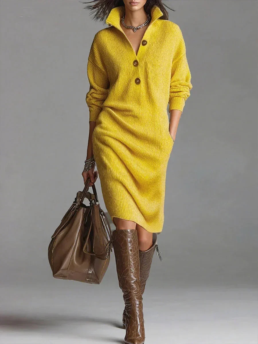 Close-up view of ribbed knit jumper dress showing button placket and collar detail
