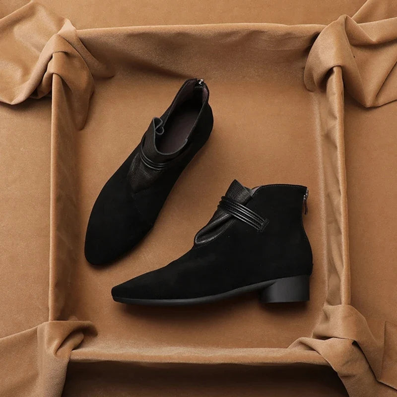 Full side view of women's suede ankle boots with block heel