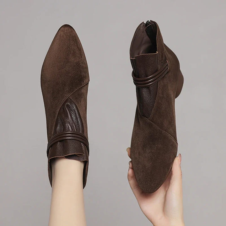 Close-up of heel counter and rear zip on suede ankle boots