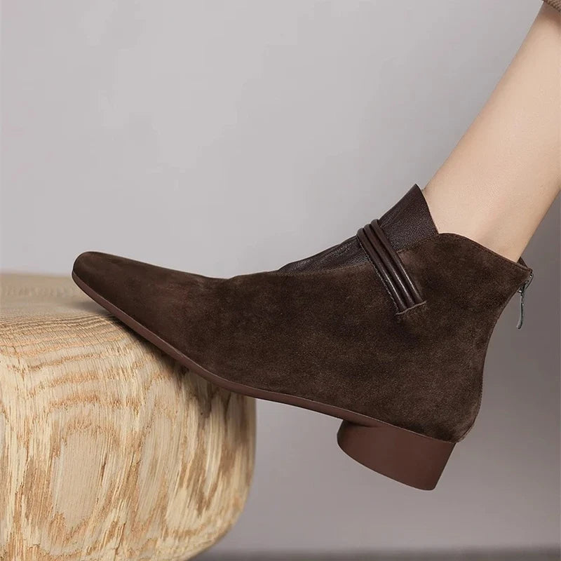Three-quarter rear view of women's ankle boots in dark brown