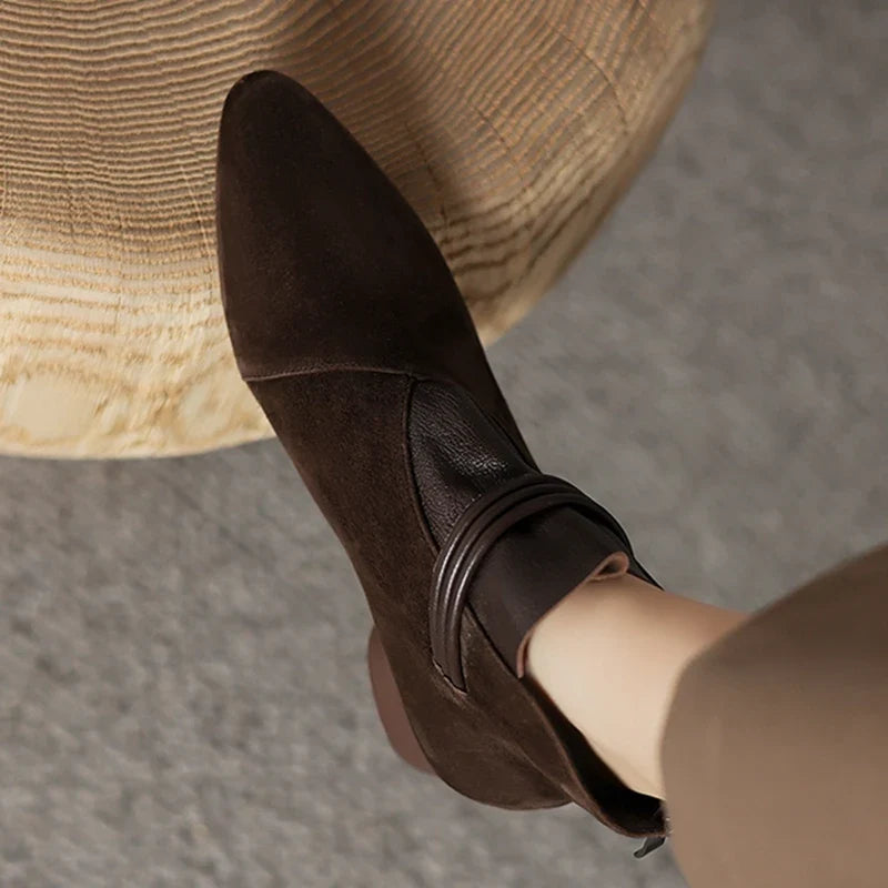 Detail of cushioned insole support in women's suede ankle boots