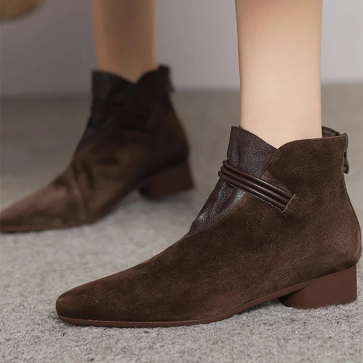 Side profile showing low heel height and pointed-toe design