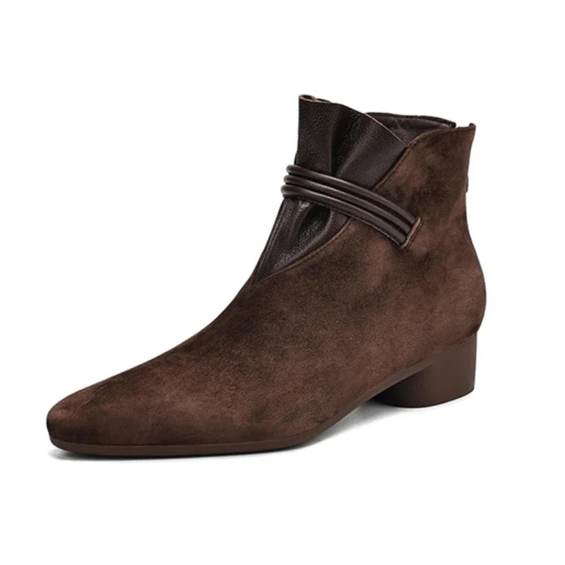 Detail of side-zip fastening and ankle opening on boots