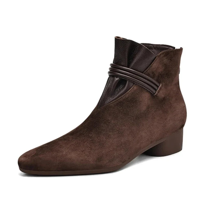 Detail of side-zip fastening and ankle opening on boots