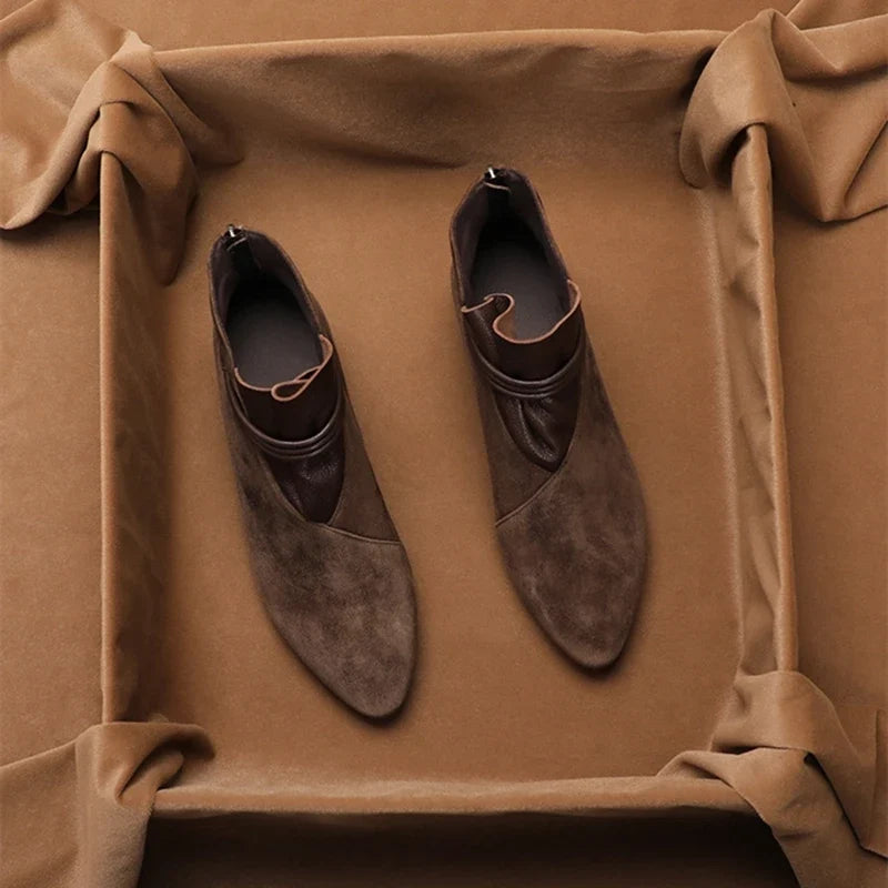 Back view of women's ankle boots highlighting low block heel and rear zip fastening