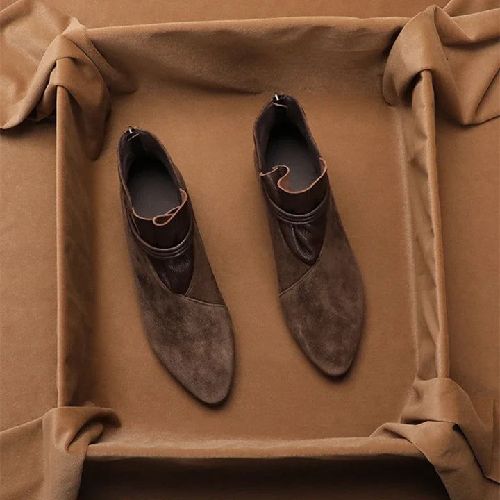 Back view of women's ankle boots highlighting low block heel and rear zip fastening
