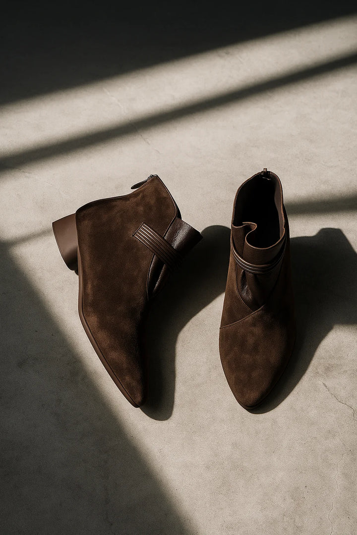Women's suede ankle boots styled with tailored trousers for everyday wear