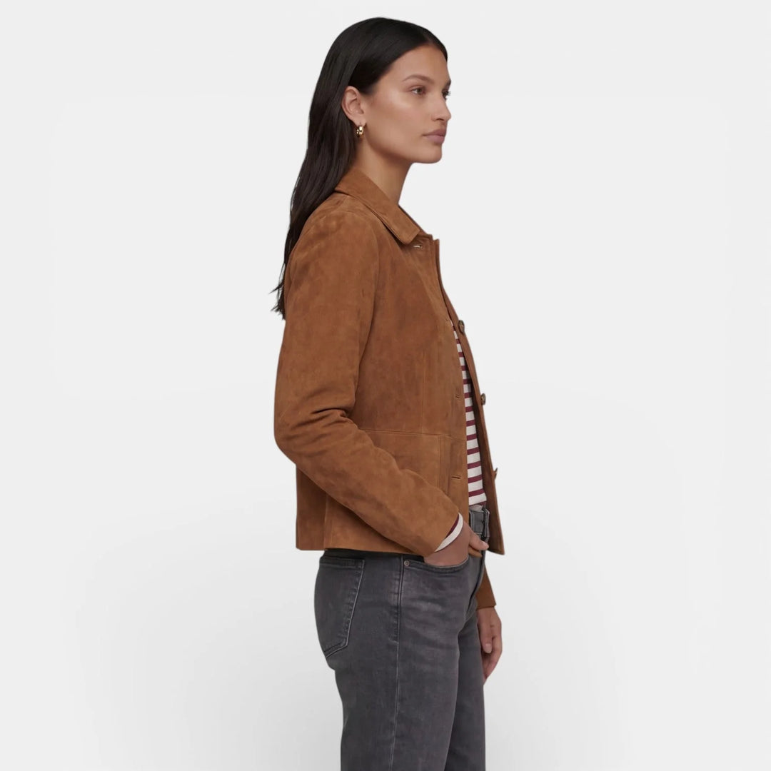 Close-up view of women's brown suede jacket showing soft-touch fabric finish and button detail