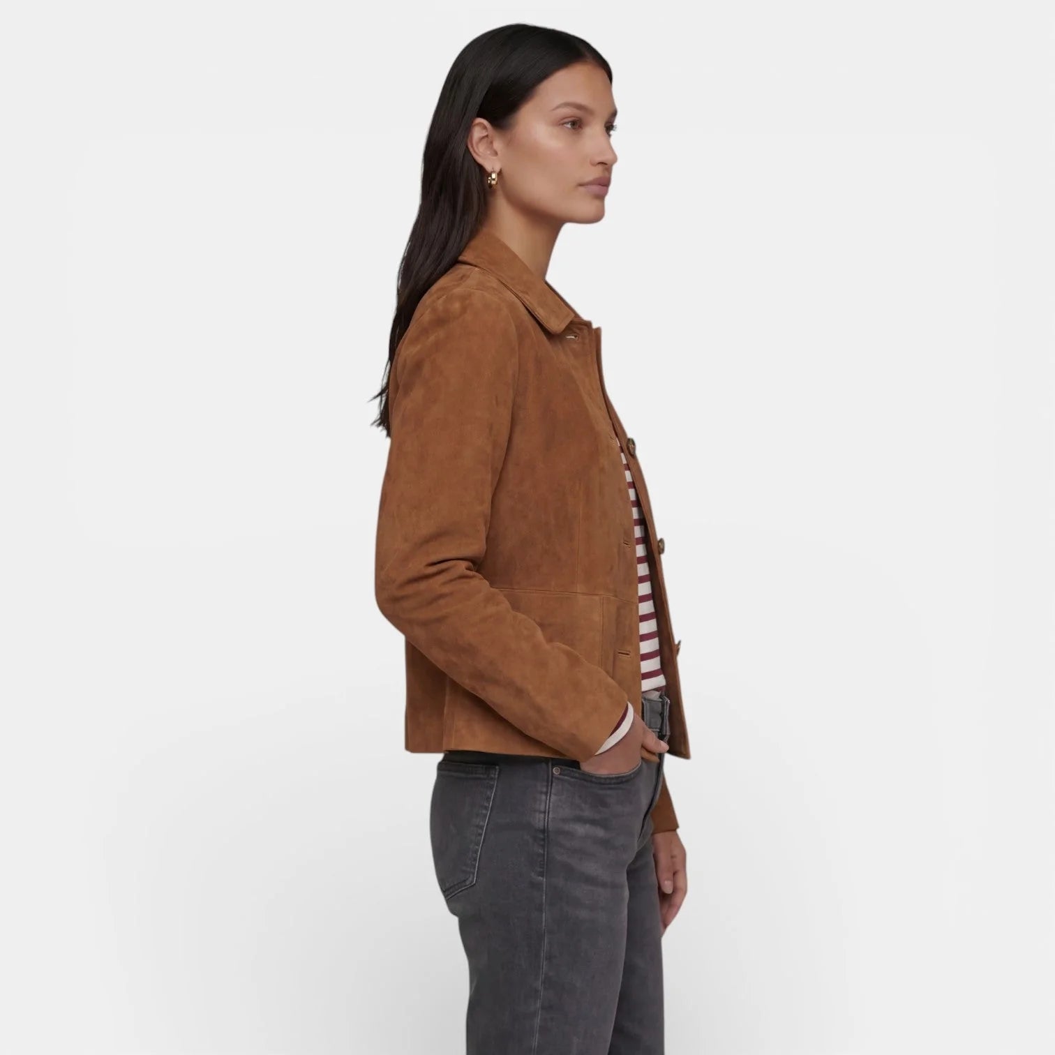 Close-up view of women's brown suede jacket showing soft-touch fabric finish and button detail