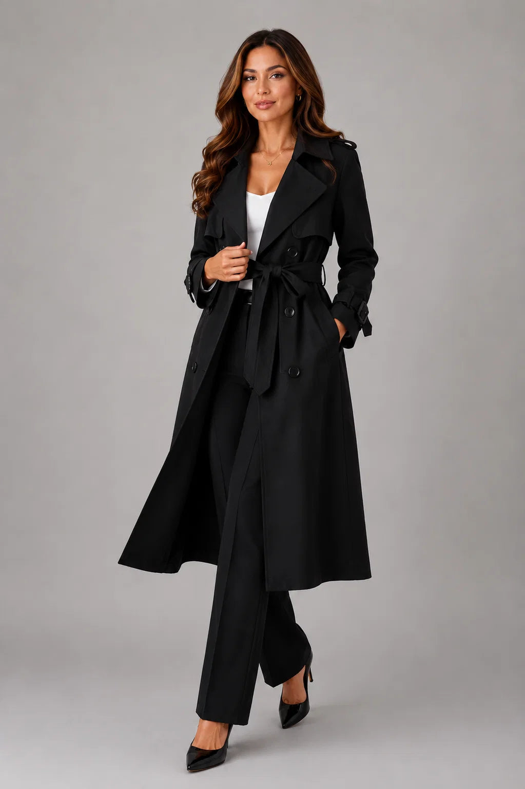 Longline trench coat featuring notched lapels and structured woven fabric in neutral tone