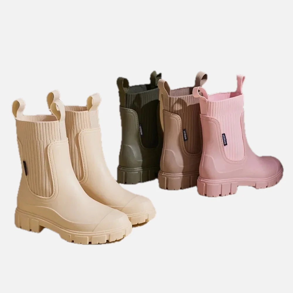 Women's Chelsea rain boots in five colours displayed on white background showing waterproof construction and chunky sole