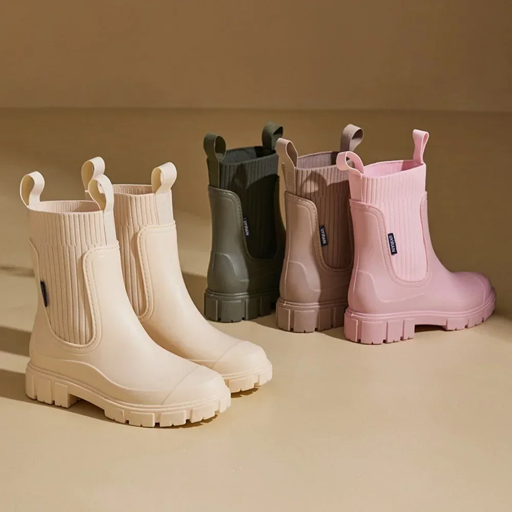 Side view of women's waterproof Chelsea rain boots with anti-slip tread sole and pull tab