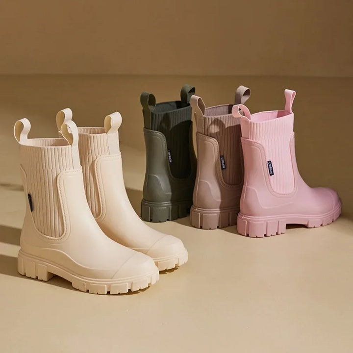Side view of women's waterproof Chelsea rain boots with anti-slip tread sole and pull tab