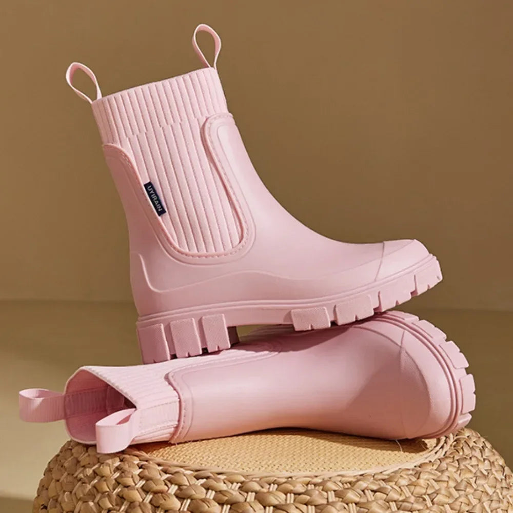 Women's Chelsea rain boots in beige showing slip-on design with elasticated gussets and heel loop