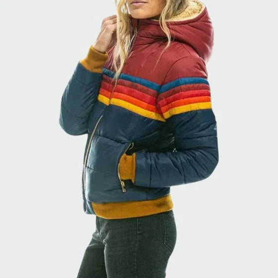 Detail of puffer jacket zip pockets and waterproof shell fabric with insulated padding throughout