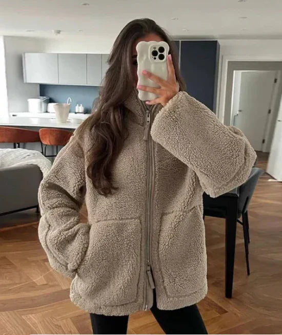 Full-length view of the women's oversized teddy fleece jacket paired with everyday basics