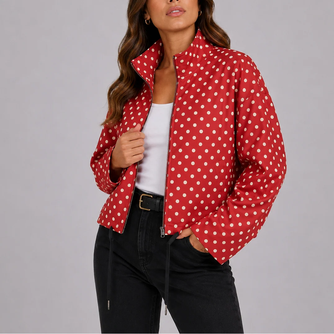 Detail shot of polka dot bomber jacket collar and zip closure with structured fabric finish
